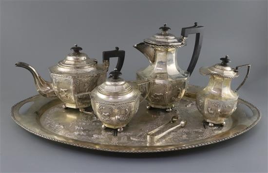 An early-mid 20th century Indian five piece white metal tea service with tea tray, gross 137oz.
